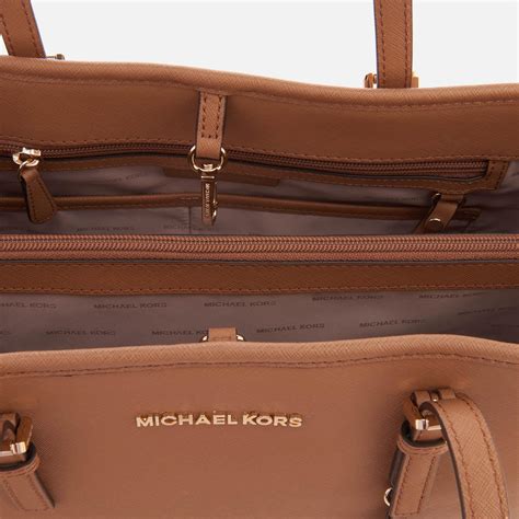 michael michael kors jet set travel tote admiral|Michael Kors bag with airplanes.